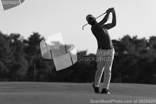 Image of golfer hitting long shot