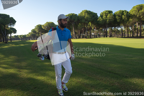 Image of golf player walking