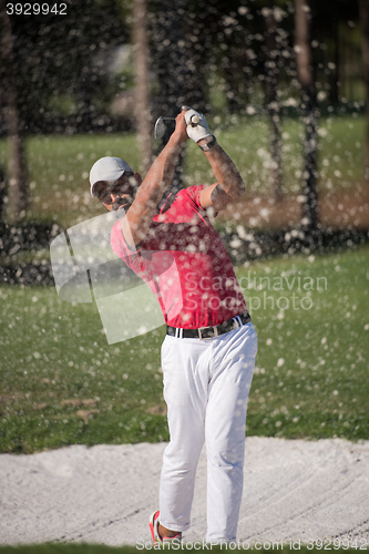 Image of golfer hitting a sand bunker shot