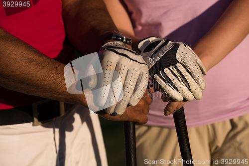 Image of portrait of couple on golf course