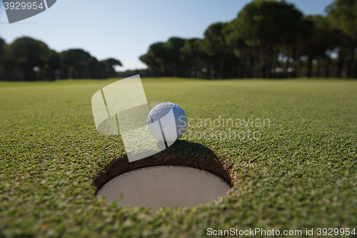 Image of golf ball in the hole