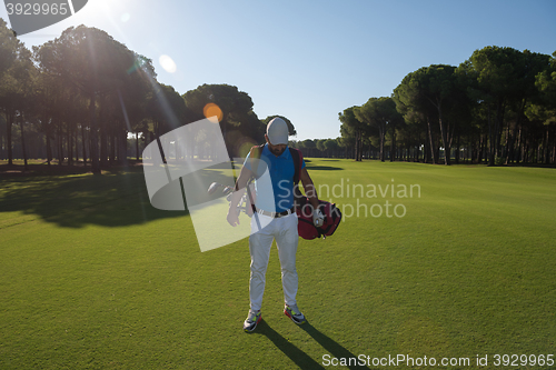 Image of golf player walking