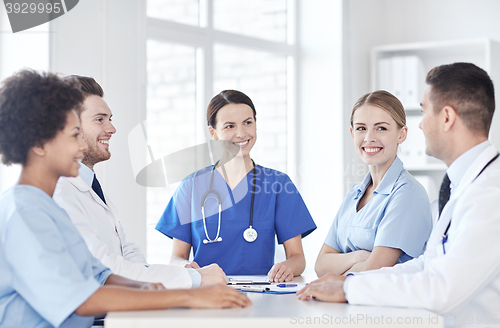 Image of group of happy doctors meeting at hospital office