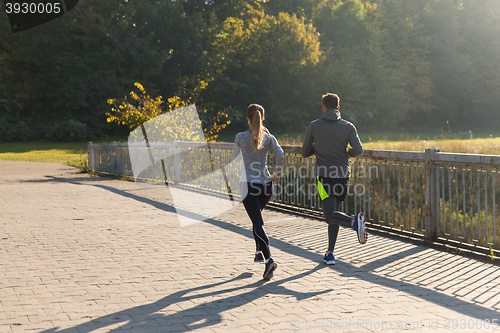 Image of couple running or jogging outdoors