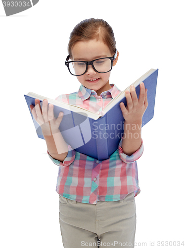 Image of happy little girl in eyeglasses reading book