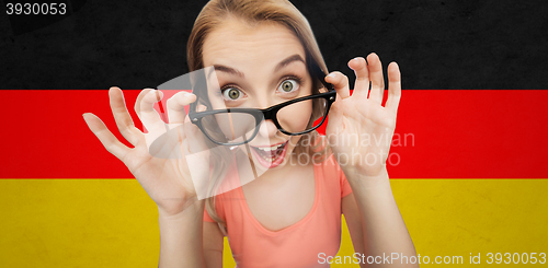 Image of happy young woman or teenage girl in eyeglasses