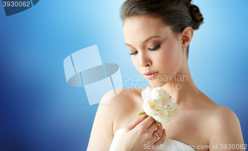 Image of beautiful asian woman with flower and jewelry