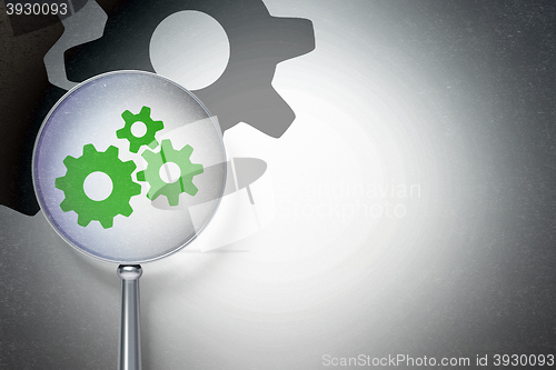 Image of Web design concept:  Gears with optical glass on digital background