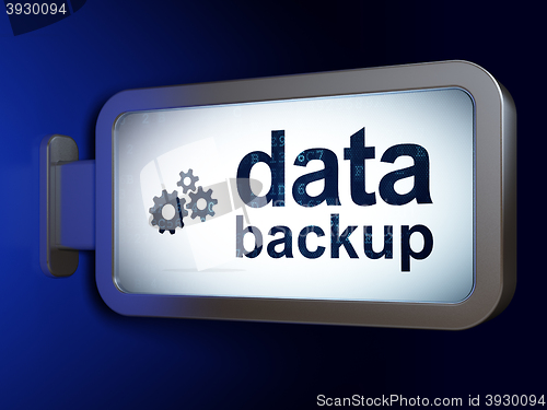 Image of Data concept: Data Backup and Gears on billboard background
