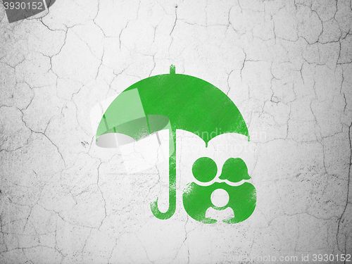 Image of Security concept: Family And Umbrella on wall background