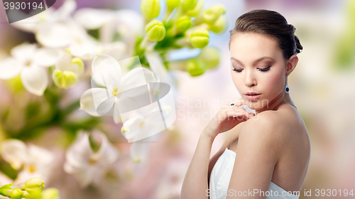 Image of beautiful woman with earring, ring and pendant