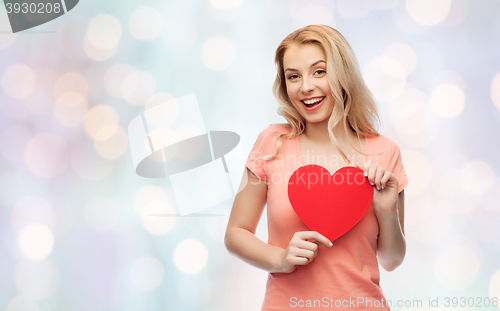 Image of happy woman or teen girl with red heart shape