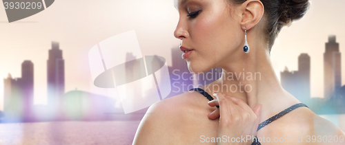 Image of close up of beautiful asian woman with earring