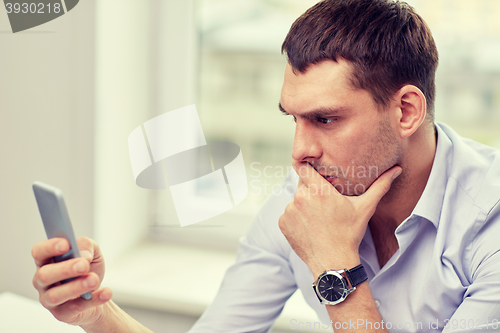 Image of close up of businessman with smartphone