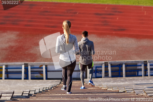 Image of couple walking downstairs on stadium