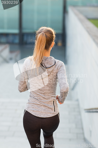 Image of close up of sporty woman running downstairs