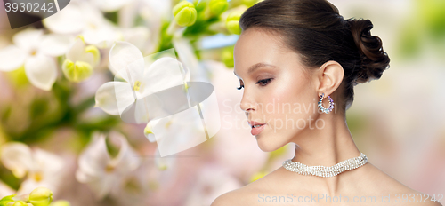 Image of close up of beautiful woman face with earring