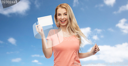 Image of happy woman or teen girl with blank white paper