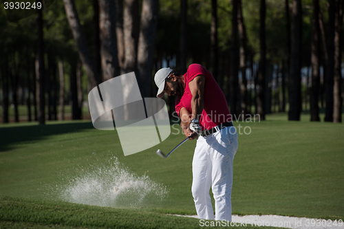 Image of golfer hitting a sand bunker shot