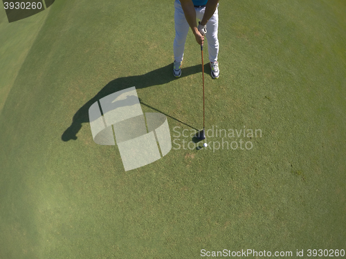 Image of top view of golf player hitting shot