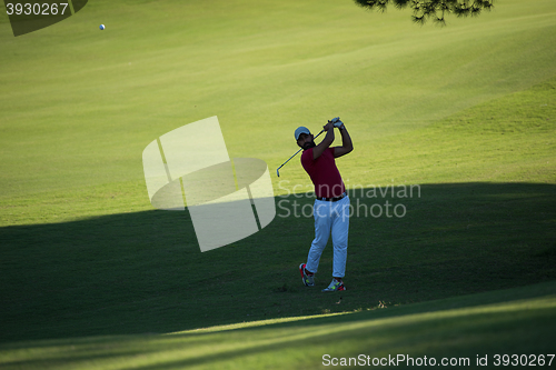 Image of golf player hitting long shot