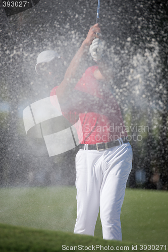 Image of golfer hitting a sand bunker shot