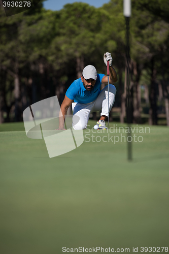 Image of golf player aiming perfect  shot