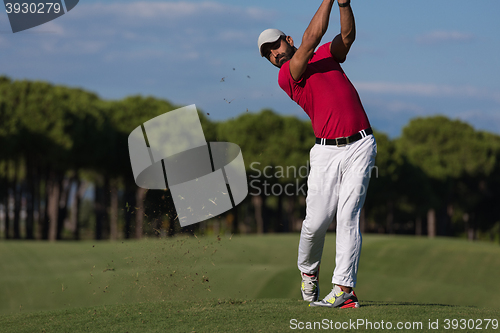 Image of golf player hitting long shot