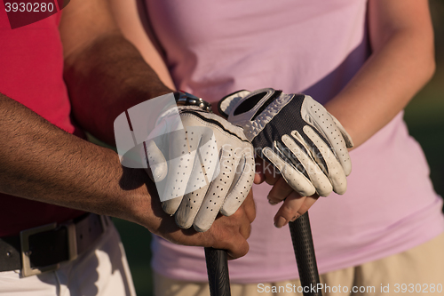 Image of portrait of couple on golf course