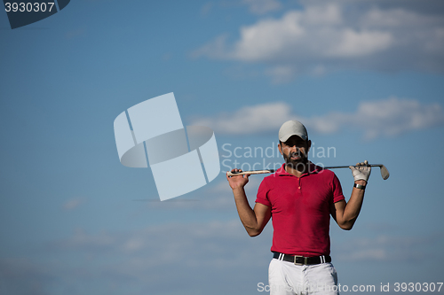 Image of handsome middle eastern golf player portrait at course