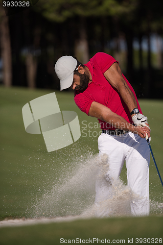 Image of golfer hitting a sand bunker shot