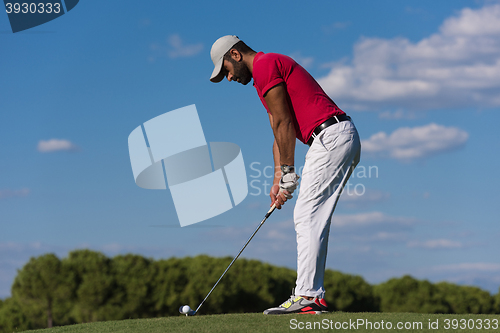 Image of golf player hitting long shot