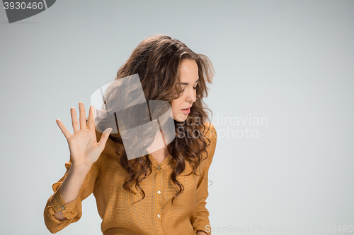 Image of The young woman\'s portrait with frightened emotions