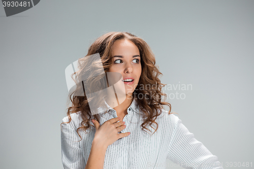 Image of The happy woman on gray background