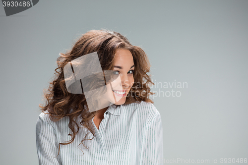 Image of The happy woman on gray background