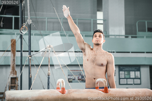 Image of The sportsman before difficult exercise, sports gymnastics