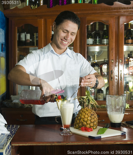 Image of editorial bartender mixing drink in restaurant Corn Island Nicar