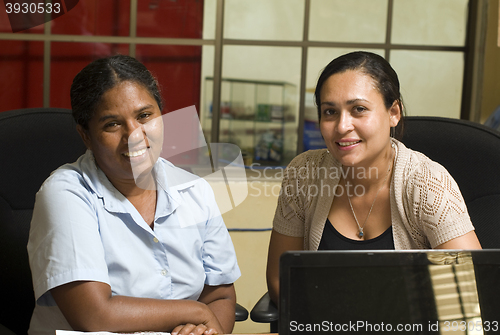 Image of two office lady female manager workers  management office hotel 