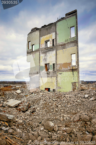 Image of Pieces of Metal and Stone are Crumbling from Demolished Building