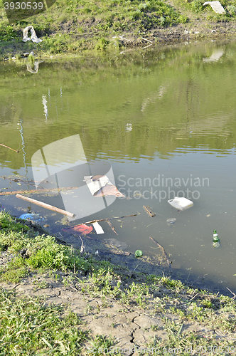 Image of Rubbish, waste floating in polluted pond
