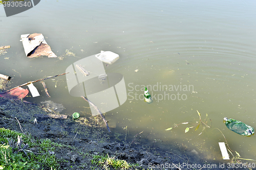 Image of Rubbish, waste floating in polluted pond