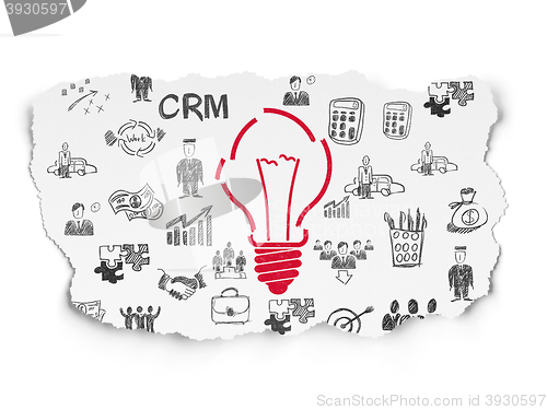Image of Business concept: Light Bulb on Torn Paper background