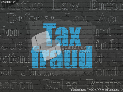 Image of Law concept: Tax Fraud on wall background