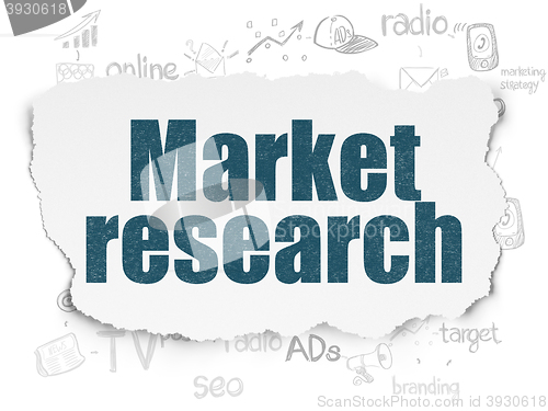 Image of Advertising concept: Market Research on Torn Paper background