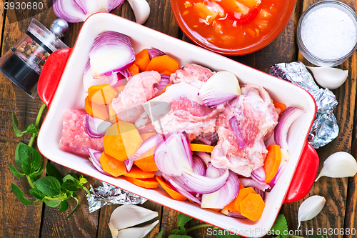 Image of raw meat with vegetables