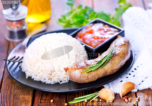 Image of boiled rice with sausages