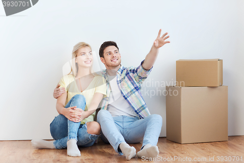 Image of couple with boxes moving to new home and dreaming