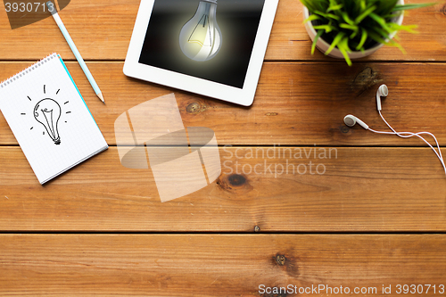 Image of close up of tablet pc computer on wooden table