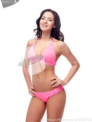 Image of happy young woman in pink bikini swimsuit