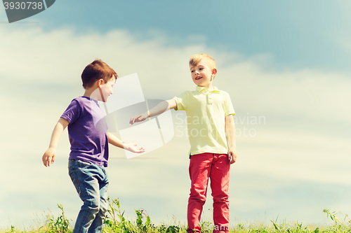 Image of happy little boys outdoors